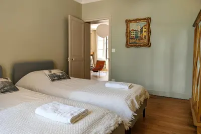 Un ou plusieurs lits dans un hébergement de l'établissement La Maison Royale - Calme en Plein Centre d'Amboise