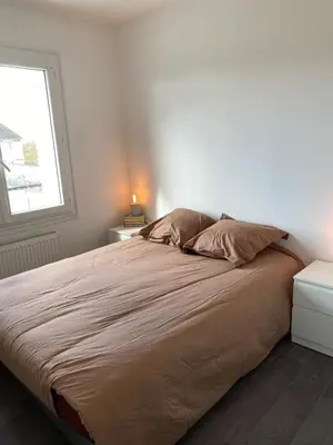 Un ou plusieurs lits dans un hébergement de l'établissement Appartement T3