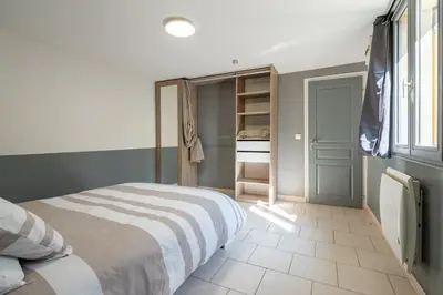 Un ou plusieurs lits dans un hébergement de l'établissement Maison Zen - 20 min du centre du Mans
