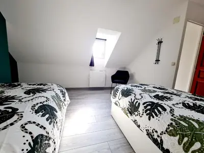 Un ou plusieurs lits dans un hébergement de l'établissement La Petite Maison Tourangelle