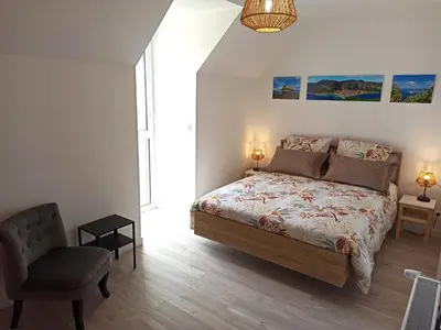 Un ou plusieurs lits dans un hébergement de l'établissement Chambres d'hôtes Le puits du Bréneau