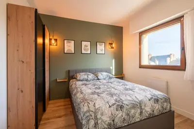 Un ou plusieurs lits dans un hébergement de l'établissement Le Rivage - Wifi - Centre-ville