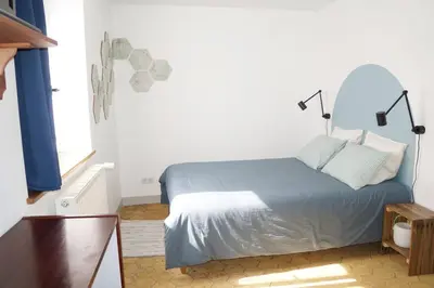 Un ou plusieurs lits dans un hébergement de l'établissement Chambre du Grand Moulin