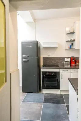 Cuisine ou kitchenette dans l'établissement Havre de Ville avec Cour Parking & Wifi GRATUIT