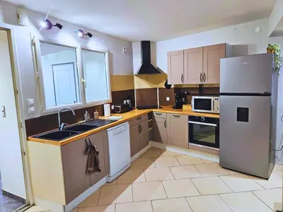 Cuisine ou kitchenette dans l'établissement Maison d'exception sur la ligne droite des Hunaudières