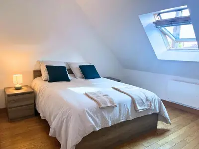Un ou plusieurs lits dans un hébergement de l'établissement Maison d'exception sur la ligne droite des Hunaudières