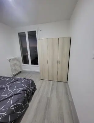 Un ou plusieurs lits dans un hébergement de l'établissement appartement 3 chambre a 10 minute du circuit