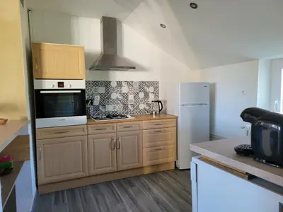 Cuisine ou kitchenette dans l'établissement Maison à louer