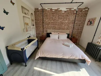 Un ou plusieurs lits dans un hébergement de l'établissement Atelier du chateau