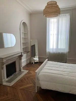 Un ou plusieurs lits dans un hébergement de l'établissement Appartement #2 cœur de ville