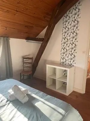 Un ou plusieurs lits dans un hébergement de l'établissement Maison de campagne Luzé