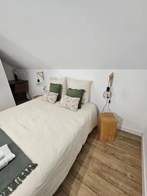 Un ou plusieurs lits dans un hébergement de l'établissement Gite le Magnolia entre Loire et châteaux