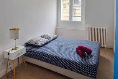 Un ou plusieurs lits dans un hébergement de l'établissement Maison cosy centre-ville 5 chambres