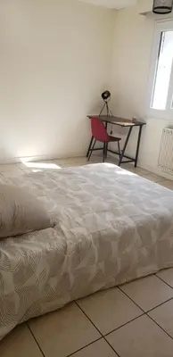 Un ou plusieurs lits dans un hébergement de l'établissement Grand appartement à Thouars