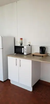 Cuisine ou kitchenette dans l'établissement Grand appartement à Thouars
