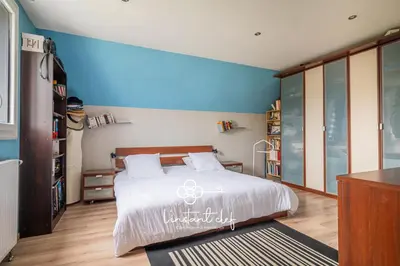 Un ou plusieurs lits dans un hébergement de l'établissement Havre familial avec piscine à deux pas du Mans