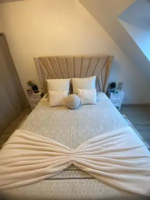 Un ou plusieurs lits dans un hébergement de l'établissement Appartement proche de l'entrée des 24h