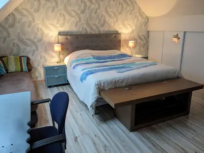 Un ou plusieurs lits dans un hébergement de l'établissement Maison Du cerf - proche du circuit et du golf des 24H