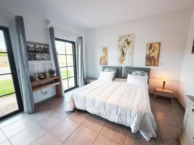 Un ou plusieurs lits dans un hébergement de l'établissement Studio cosy dans une ecurie en Touraine