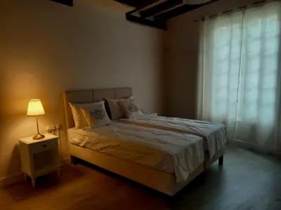 Un ou plusieurs lits dans un hébergement de l'établissement Maison avec vue le Vieux Mans