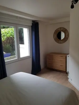 Un ou plusieurs lits dans un hébergement de l'établissement appartement cosy avec jardin Amboise