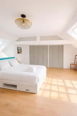Un ou plusieurs lits dans un hébergement de l'établissement La maison aux 5 nids