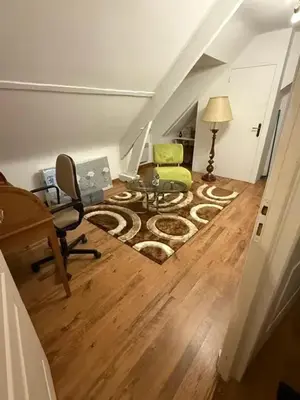 Coin salon dans l'établissement Appartement confortable avec piscine à Cour-Cheverny