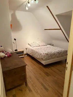 Un ou plusieurs lits dans un hébergement de l'établissement Appartement confortable avec piscine à Cour-Cheverny