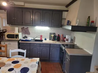 Cuisine ou kitchenette dans l'établissement Maison de campagne le Joncher