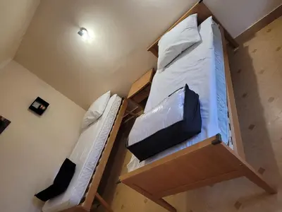 Un ou plusieurs lits dans un hébergement de l'établissement Maison de campagne le Joncher
