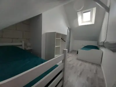 Un ou plusieurs lits dans un hébergement de l'établissement Gîte aux Pissenlits