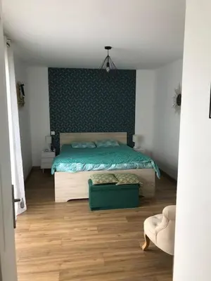 Un ou plusieurs lits dans un hébergement de l'établissement Maison Changé 4 chambres