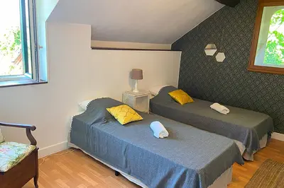 Un ou plusieurs lits dans un hébergement de l'établissement La maison du gardien