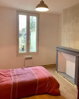 Un ou plusieurs lits dans un hébergement de l'établissement Appartement centre ville Chateau-Renault