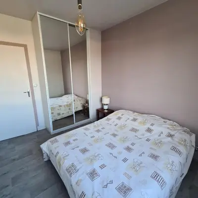 Un ou plusieurs lits dans un hébergement de l'établissement Chambre proche circuit du mans
