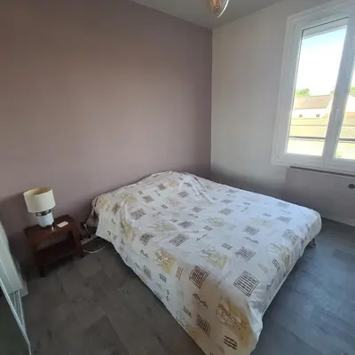 Un ou plusieurs lits dans un hébergement de l'établissement Chambre proche circuit du mans