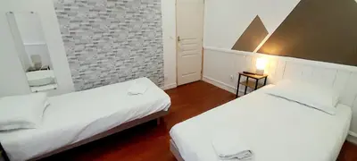 Un ou plusieurs lits dans un hébergement de l'établissement Charmant appartement 6 pers