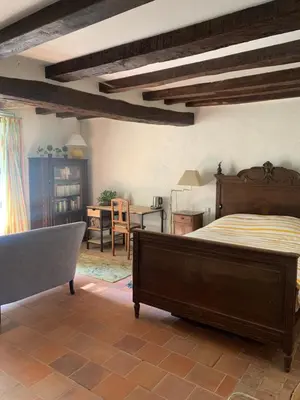 Un ou plusieurs lits dans un hébergement de l'établissement Maison de charme