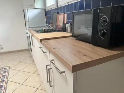 Cuisine ou kitchenette dans l'établissement Le petit Gite de Vendome