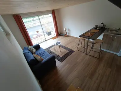 Coin salon dans l'établissement Studio en duplex 24H du Mans