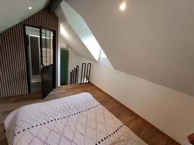 Un ou plusieurs lits dans un hébergement de l'établissement Studio en duplex 24H du Mans