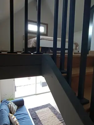 Un ou plusieurs lits dans un hébergement de l'établissement Studio en duplex 24H du Mans