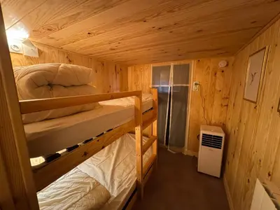 Un ou plusieurs lits dans un hébergement de l'établissement Bol de nature au Séquoia Lodge