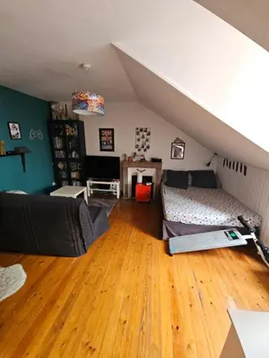 Coin salon dans l'établissement Chambre familiale chez l'habitant