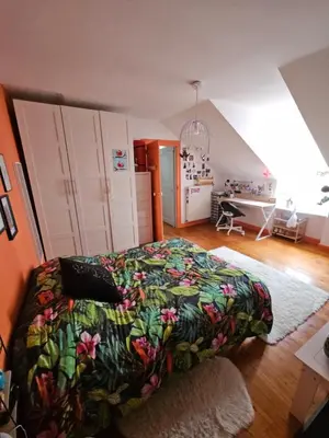 Un ou plusieurs lits dans un hébergement de l'établissement Chambre familiale chez l'habitant