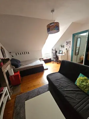 Coin salon dans l'établissement Chambre familiale chez l'habitant