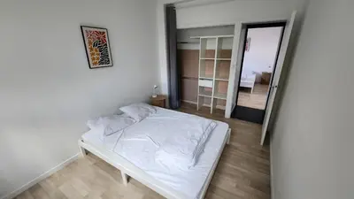 Un ou plusieurs lits dans un hébergement de l'établissement apartment 8 people 24H Le Mans