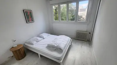 Un ou plusieurs lits dans un hébergement de l'établissement apartment 8 people 24H Le Mans
