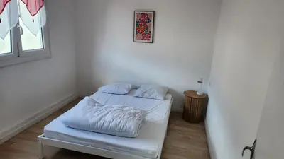 Un ou plusieurs lits dans un hébergement de l'établissement apartment 8 people 24H Le Mans