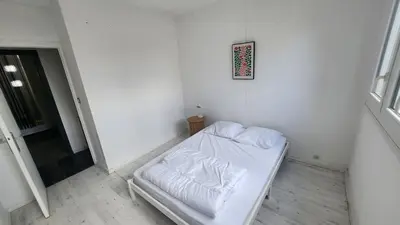 Un ou plusieurs lits dans un hébergement de l'établissement apartment 8 people 24H Le Mans